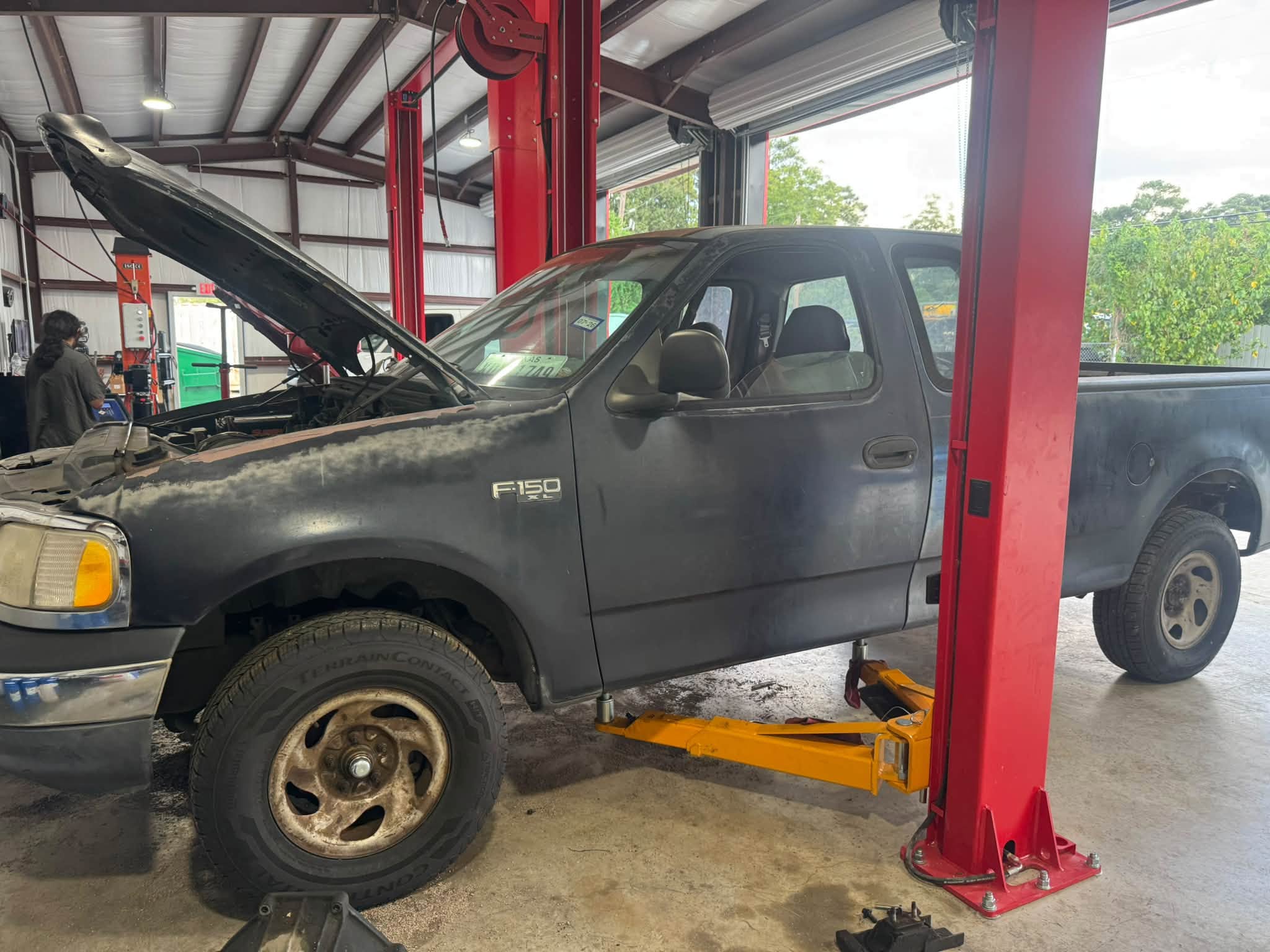 Ford pickup on a two post lift